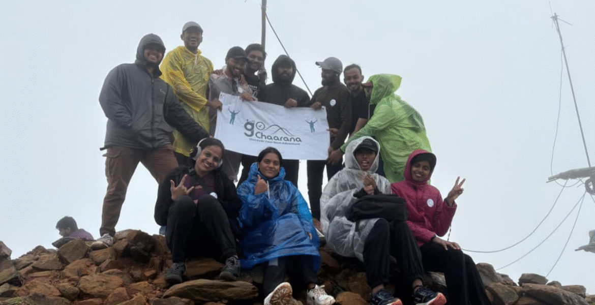 Trekking group at Kudremukh Peak during monsoon organized by goChaarana