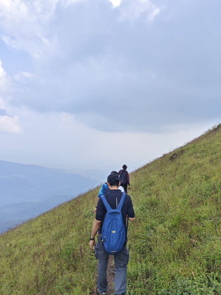 Mist-covered mountains and valleys at Meruthi Gudda Peak